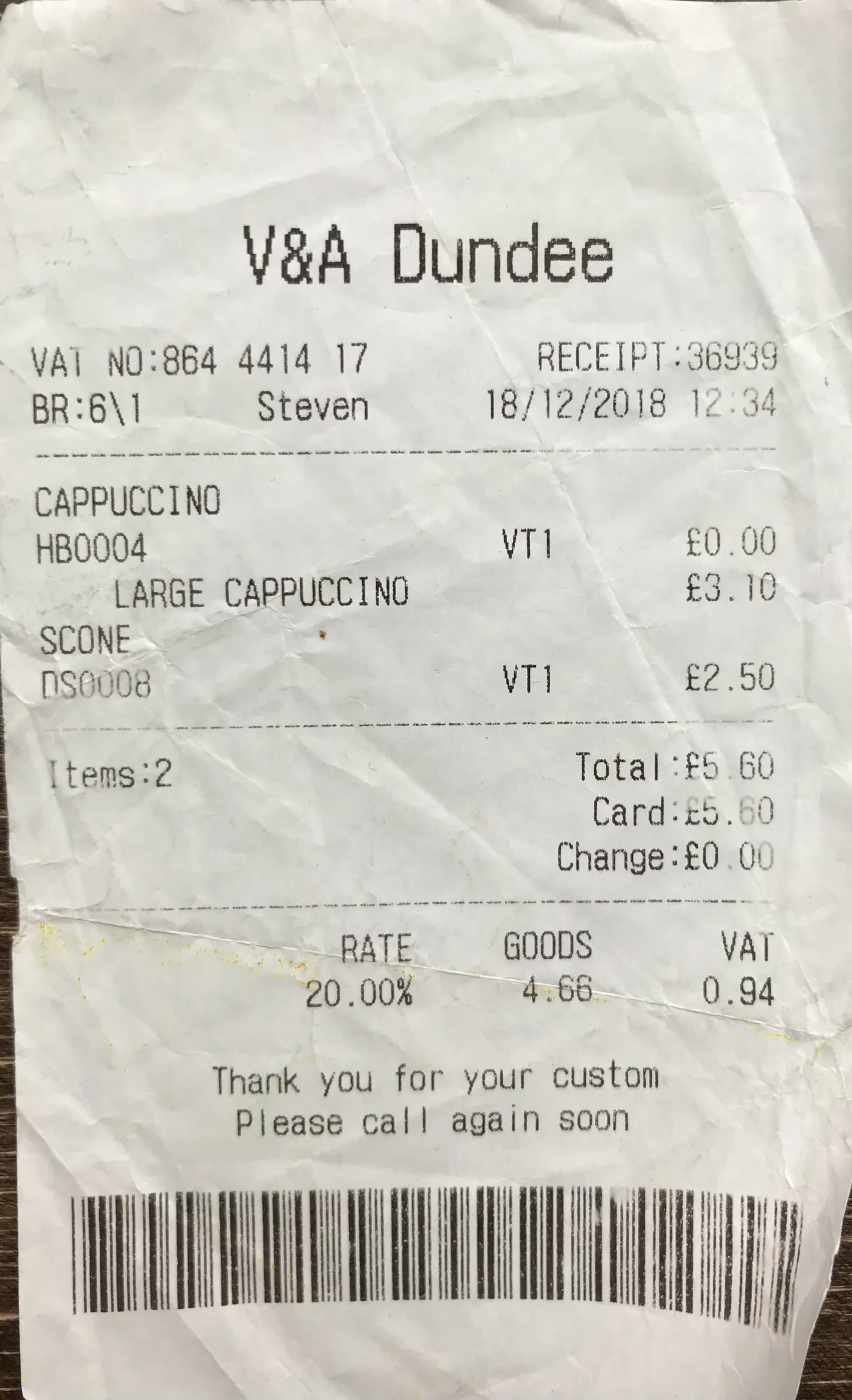 Creased V&A Dundee café receipt dated 18 December 2018 for a cappuccino and scone, totaling £5.60.