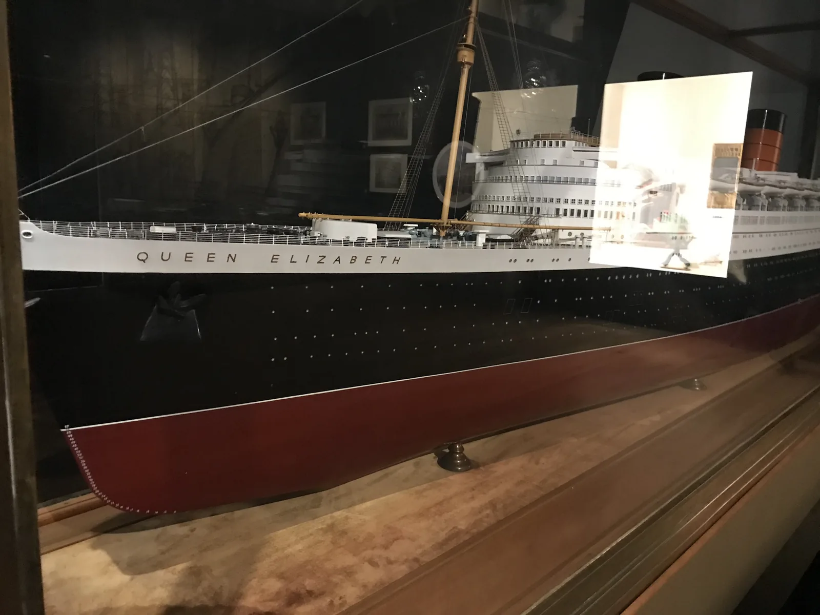 A display model of the ocean liner Queen Elizabeth in a glass case at V&A Dundee.